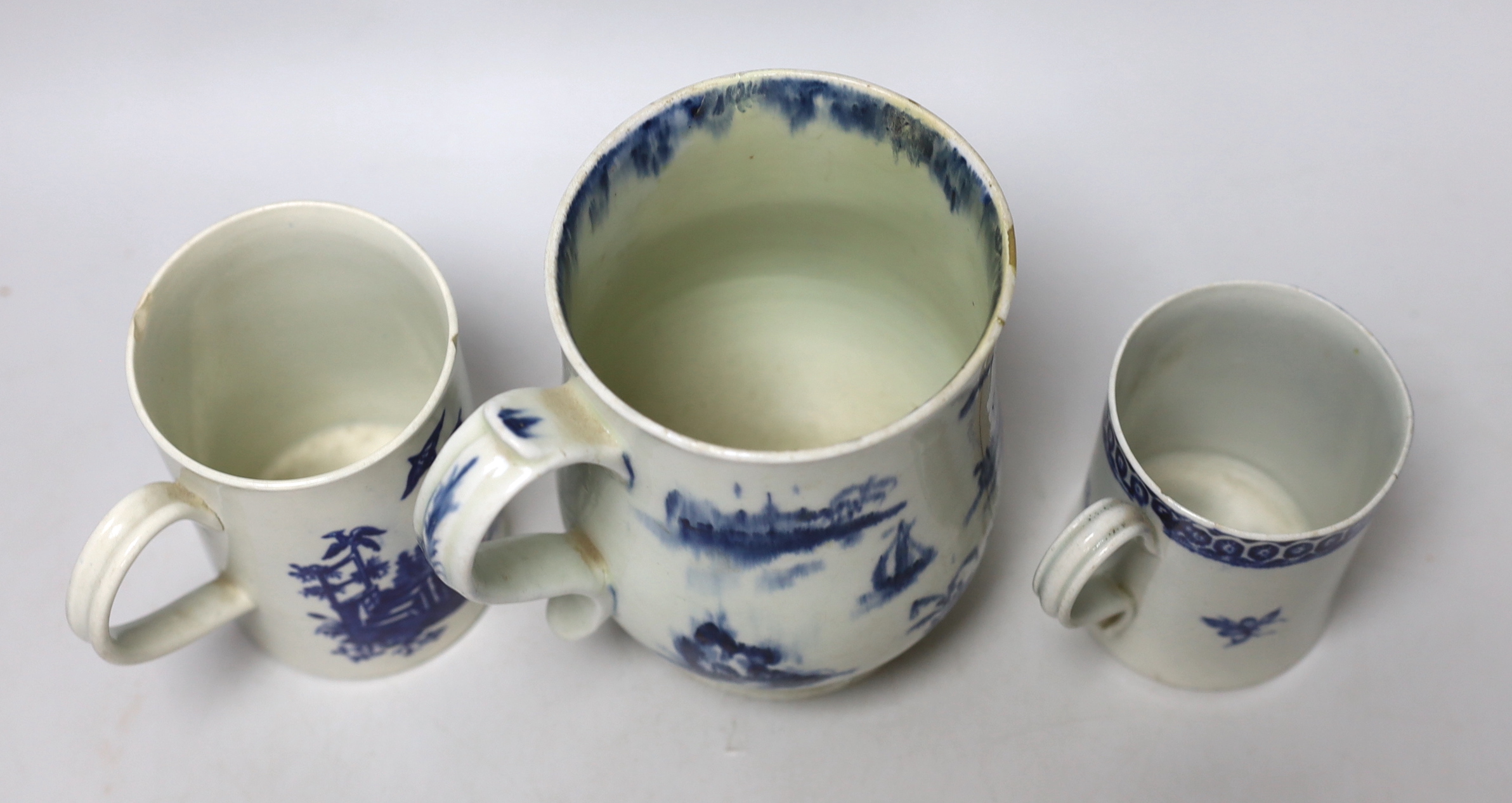 Two late 18th century Worcester blue and white mugs and a Pennington, Liverpool mug, largest 15.5cm high